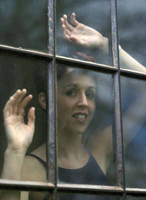 Girl looking out of a window